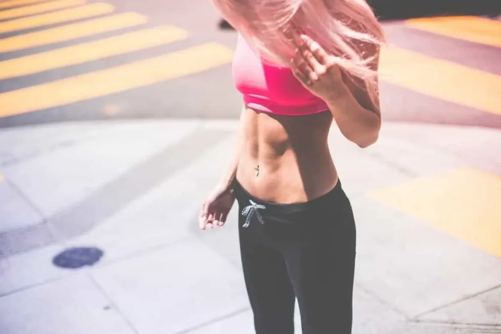 Woman with toned stomach after LA-EMS Body Sculpting Treatment Binley